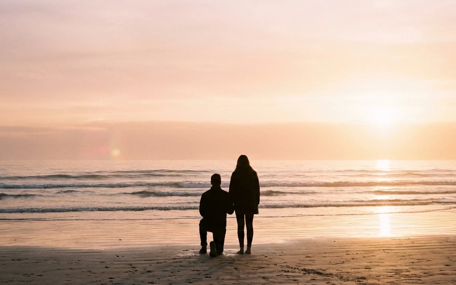 A sunset beach proposal silhouette on an Adelaide beach